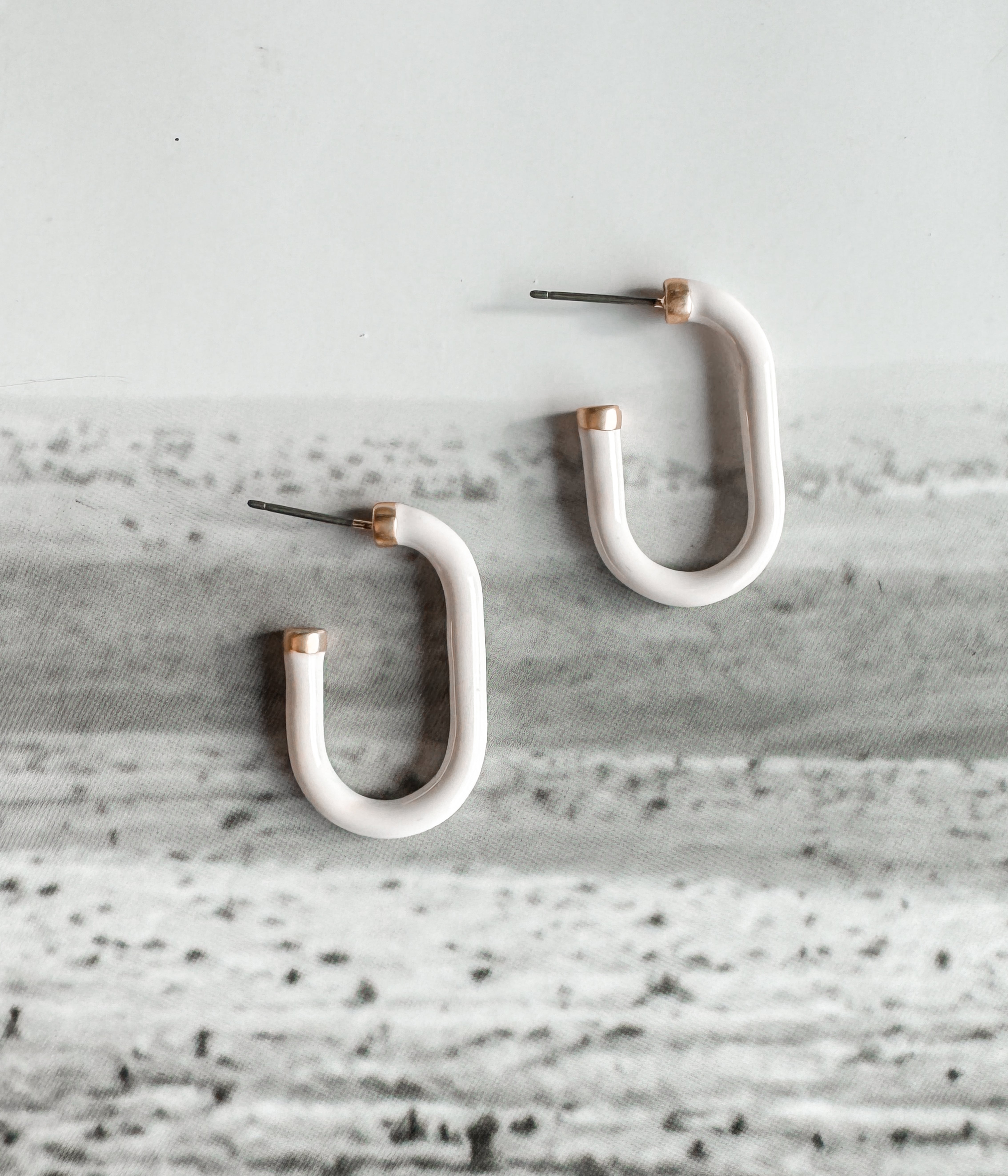 White Huggie Earrings